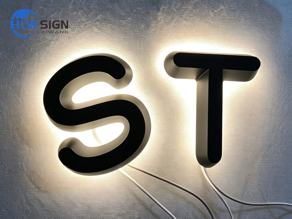 Acrylic channel letters with an illuminated face and metal return