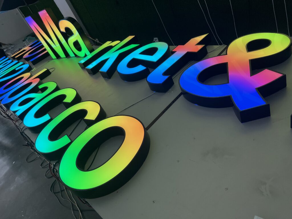 ustom RGB sign with white acrylic face and stainless steel returns for outdoor building signage